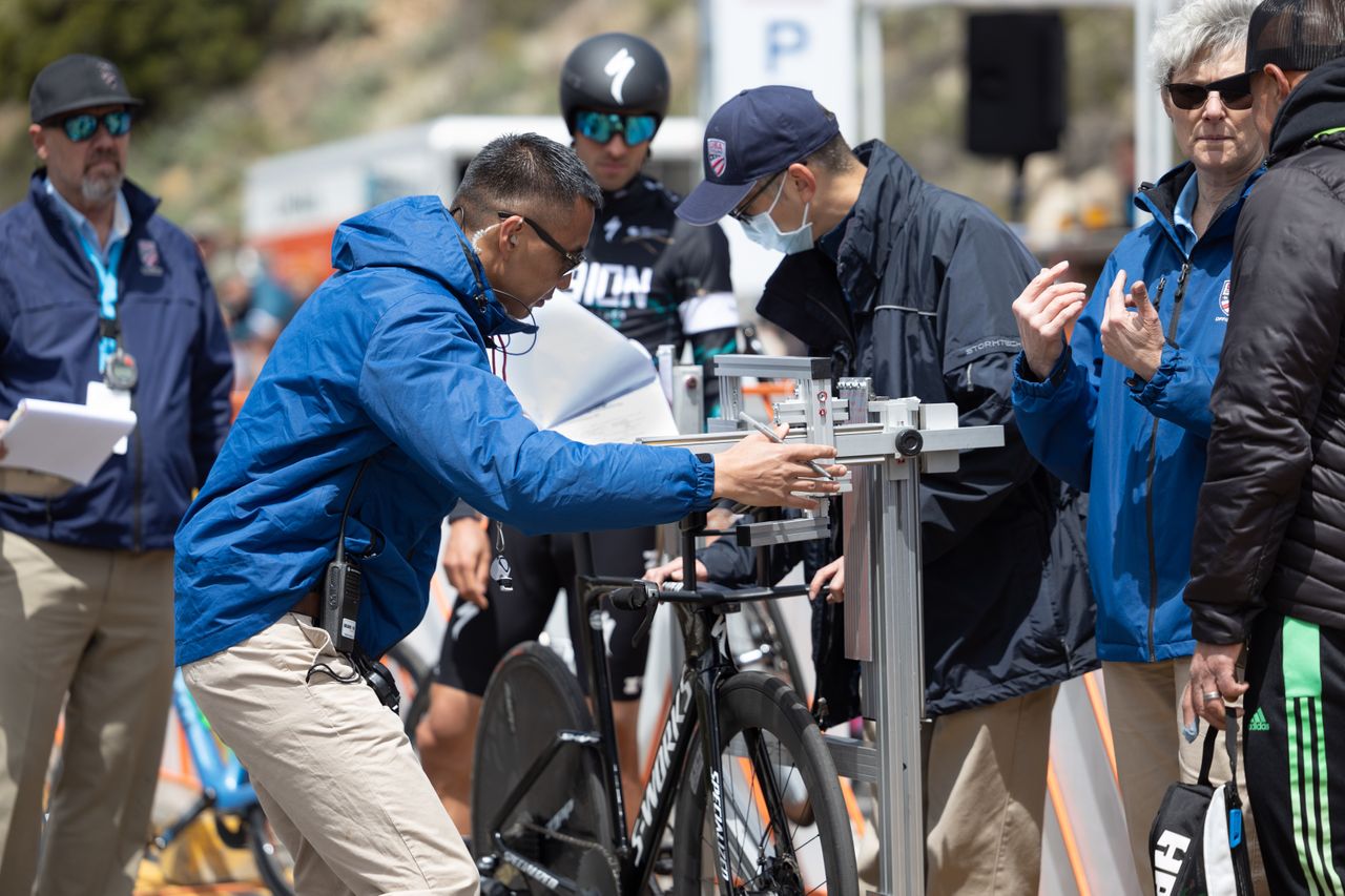 Race leader Freddie Ovett (L39ION of Los Angeles) watches as officials verify the set-up of his Time Trial bike in the jig.