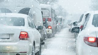 Traffic jam on a city street in winter ; Shutterstock ID 2697548641