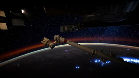 a streak of light crosses a starry sky above a dark earth below it