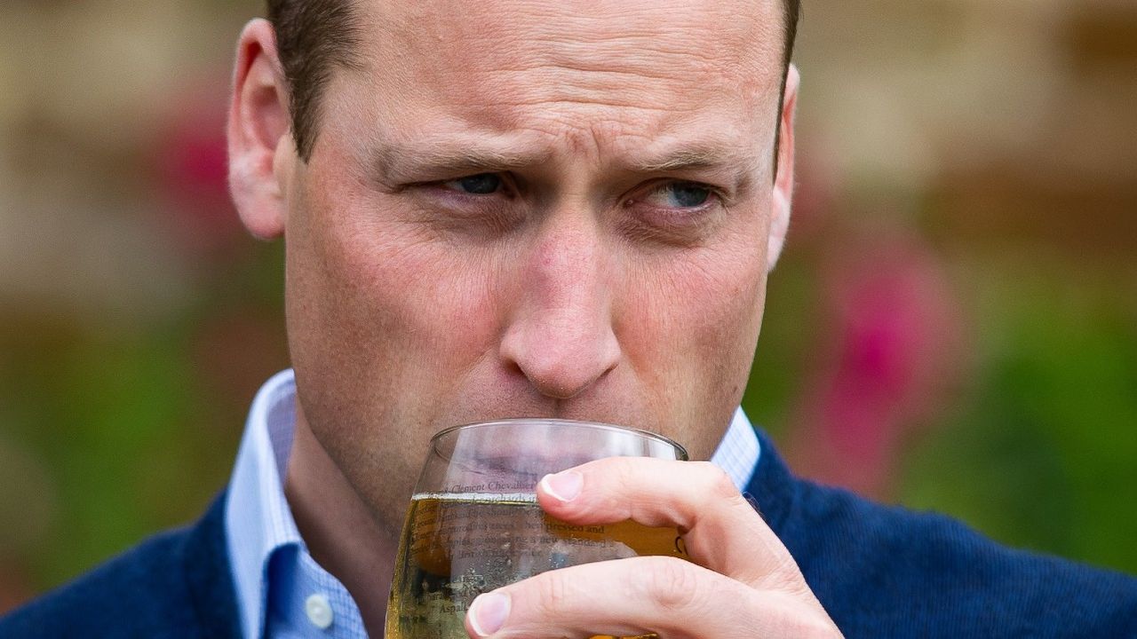 Prince William drinking at a pub