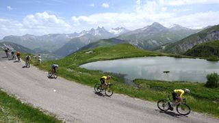 VALMEINIER 1800, FRANCE - JUNE 14: (L-R) Jonas Vingegaard of Denmark and Team Visma | Lease a Bike and Tadej Pogacar of Slovenia and UAE Team Emirates - XRG - Yellow Leader Jersey compete climbing down the Col de la Croix de Fer (2036m) during the 77th Criterium du Dauphine 2025, Stage 7 a 131.6km stage from Grand-Algueblanche to Valmeinier 1800 (1830m) / #UCIWT / on June 14, 2025 in Valmeinier 1800, France. (Photo by Dario Belingheri/Getty Images)