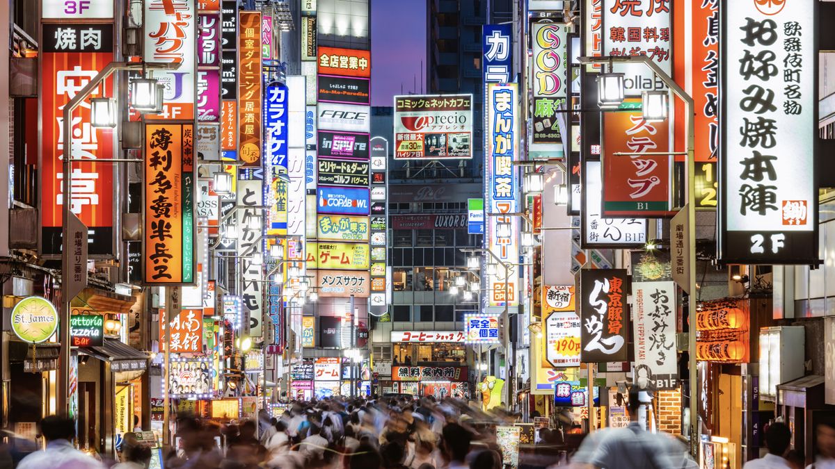 A busy street in Tokyo at night