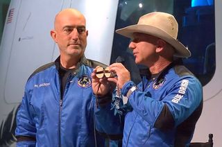 Jeff Bezos, Blue Origin's founder and newly-pinned astronaut, holds up the Amelia Earhart goggles that he and his brother flew to space aboard the New Shepard on July 20, 2021.