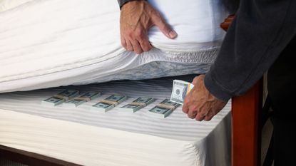 Hiding money under a mattress.