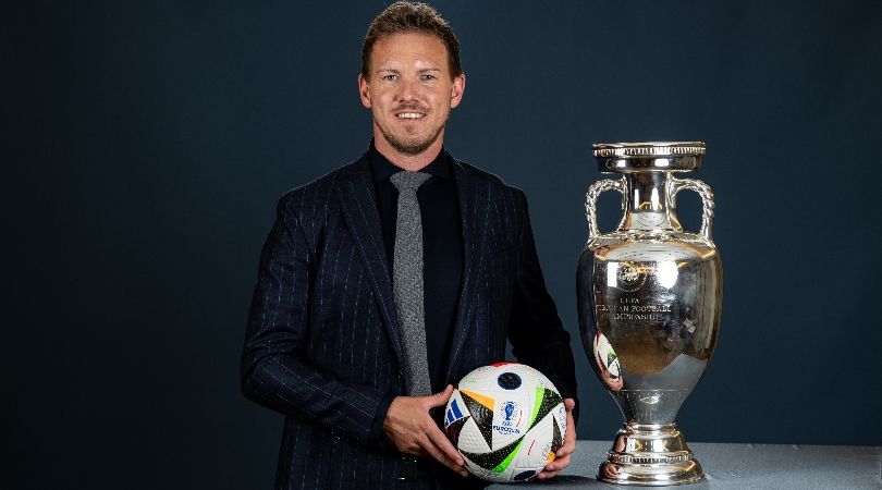 Germany coach Julian Nagelsmann poses alongside the Euro 2024 trophy in April 2024.