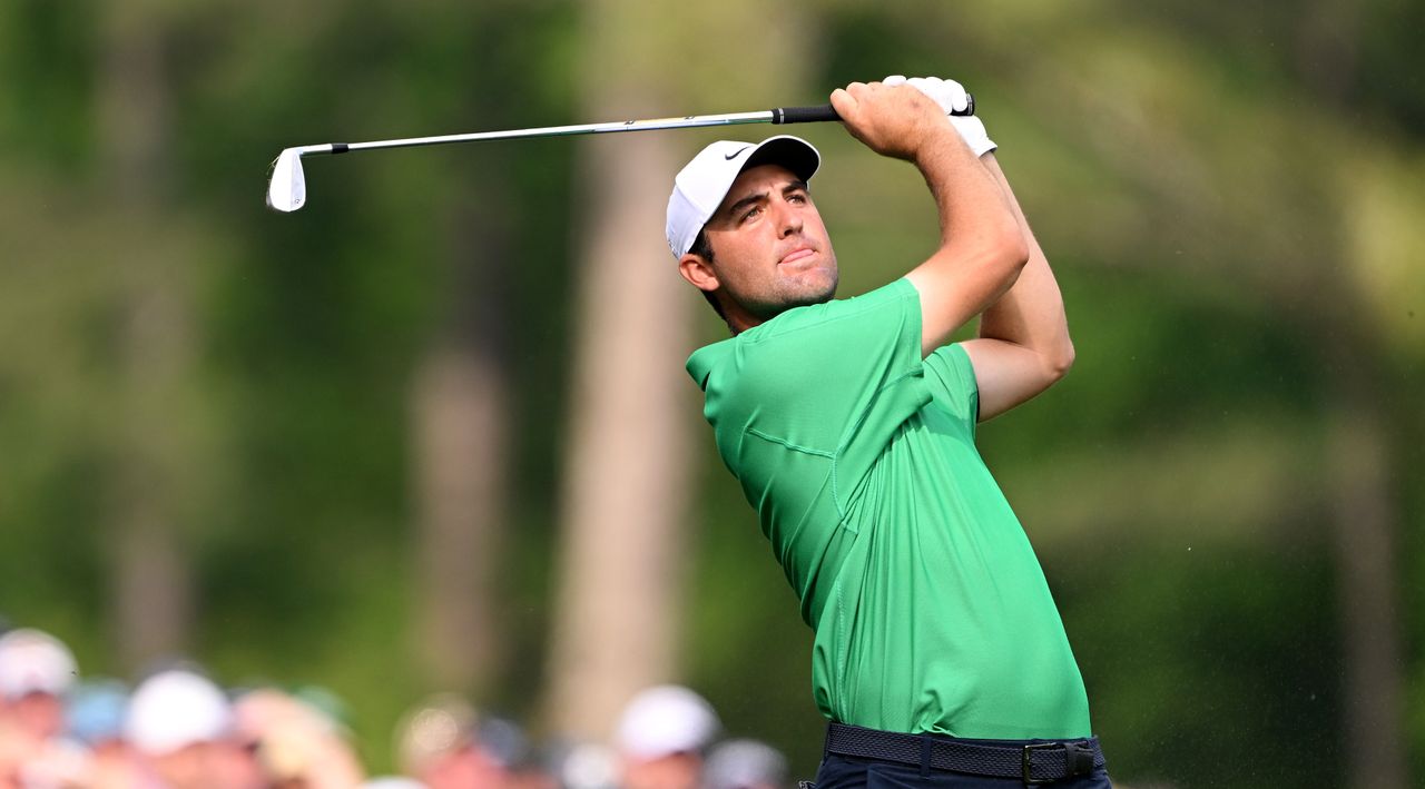 Scottie Scheffler plays his shot from the 12th tee during during the Masters.