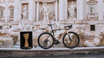 Colnago's Gioiello bike stands beside the Giro d'Italia trophy 