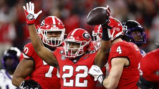 Branson Robinson #22 of the Georgia Bulldogs celebrates a touchdown in the fourth quarter ahead of the 2024/25 college football season