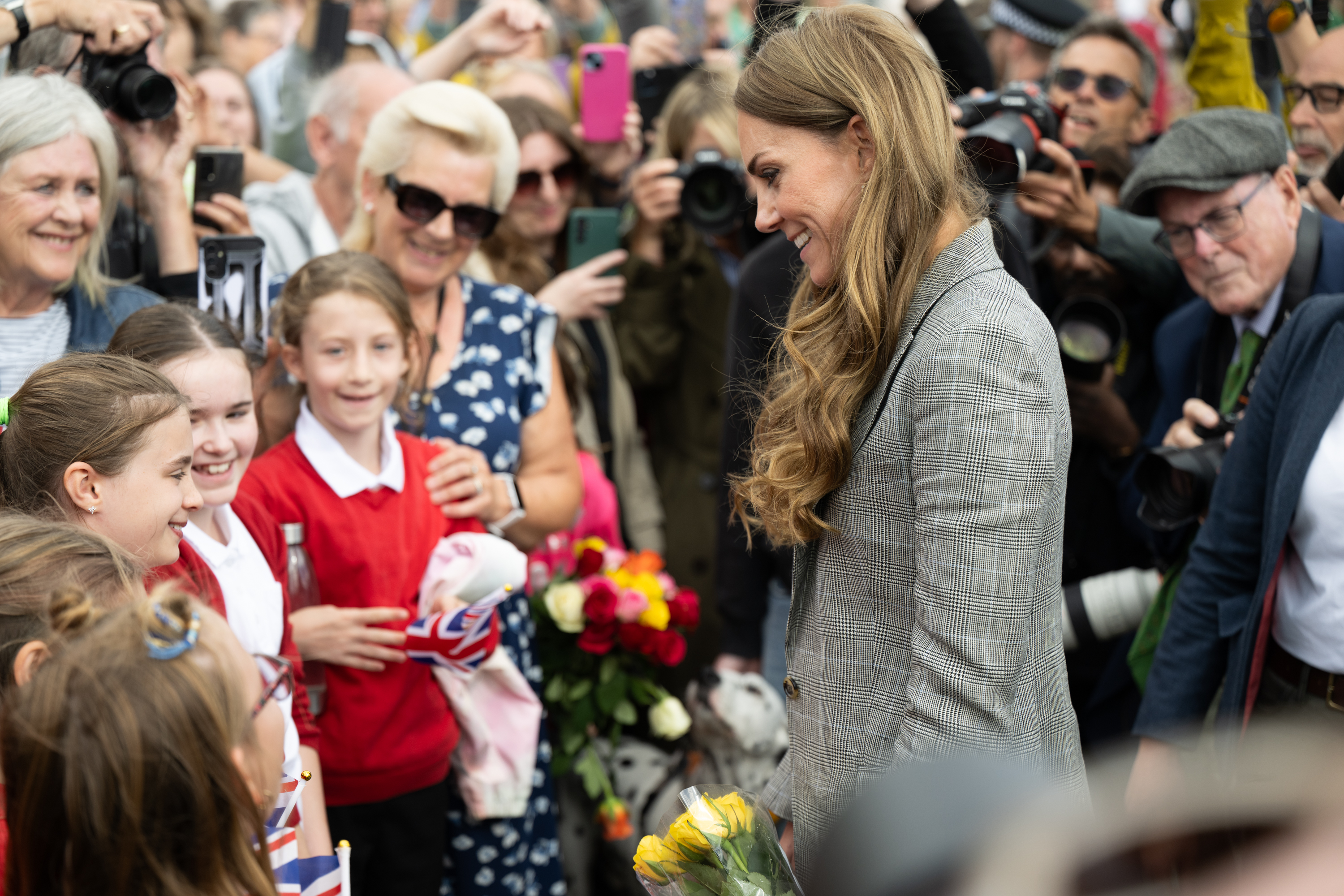 Kate Middleton attends engagement in in Sudbury wearing a plaid suit
