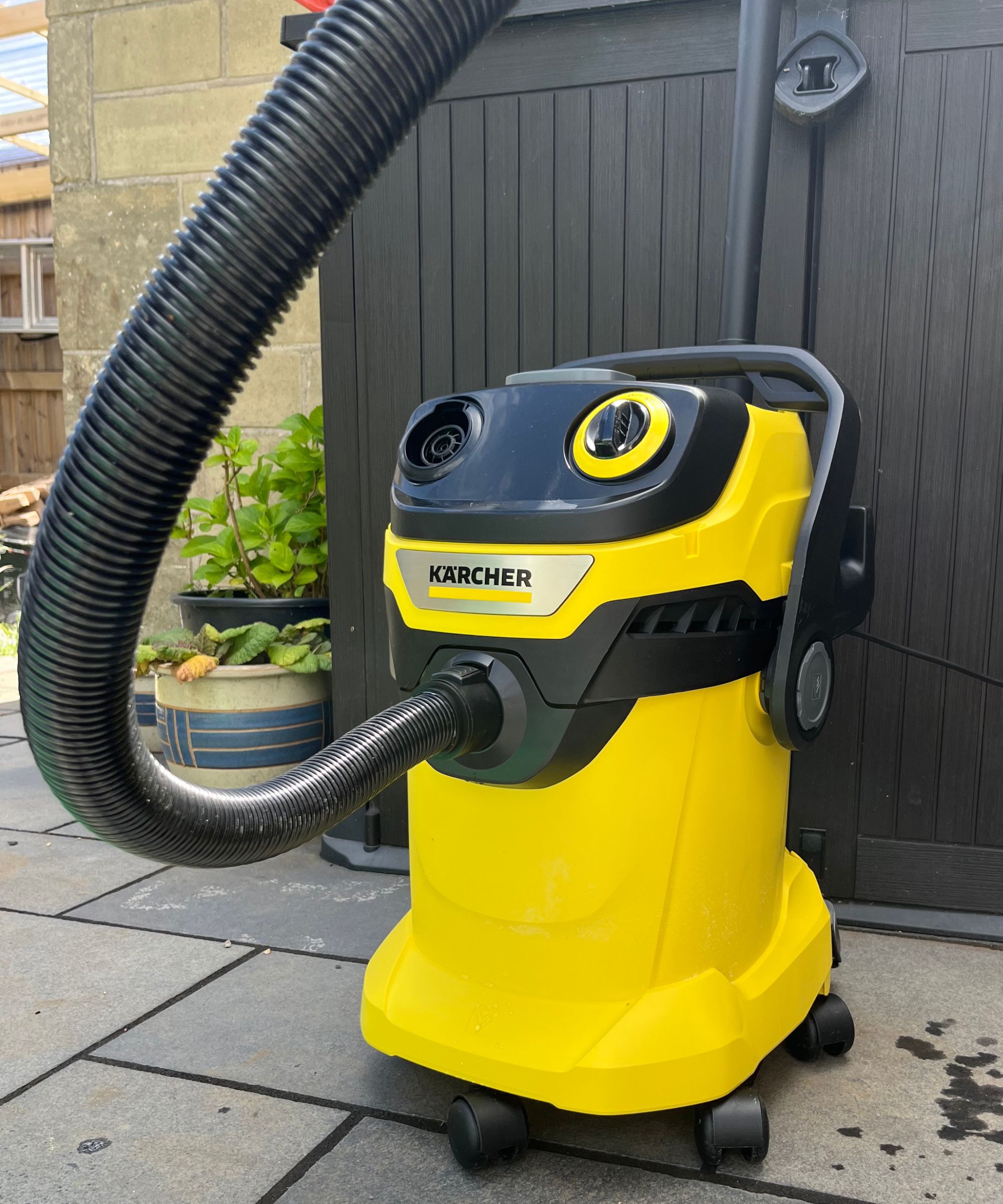 Karcher WD5 P on patio next to tool storage shed