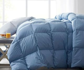 LaCrosse Premium Down Light Warmth Comforter in Porcelain Blue on a bed.