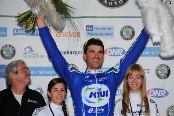 Prologue winner Jimmy Engoulvent (Saur-Sojasun) celebrates on the podium.