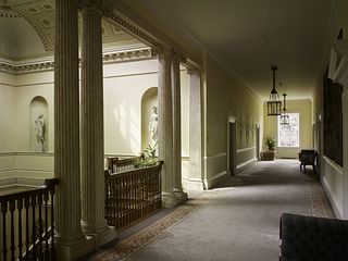 Crichel, Dorset: The main staircase rises to a long corridor with plaster decoration