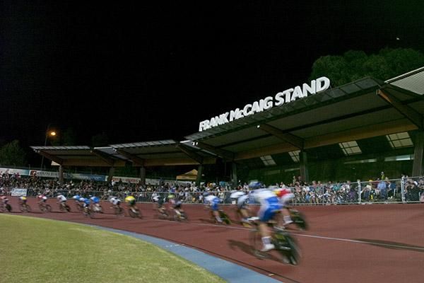 Riders speed by the Frank McCaig Stand that was opened last year in memory of the local cycling legend.