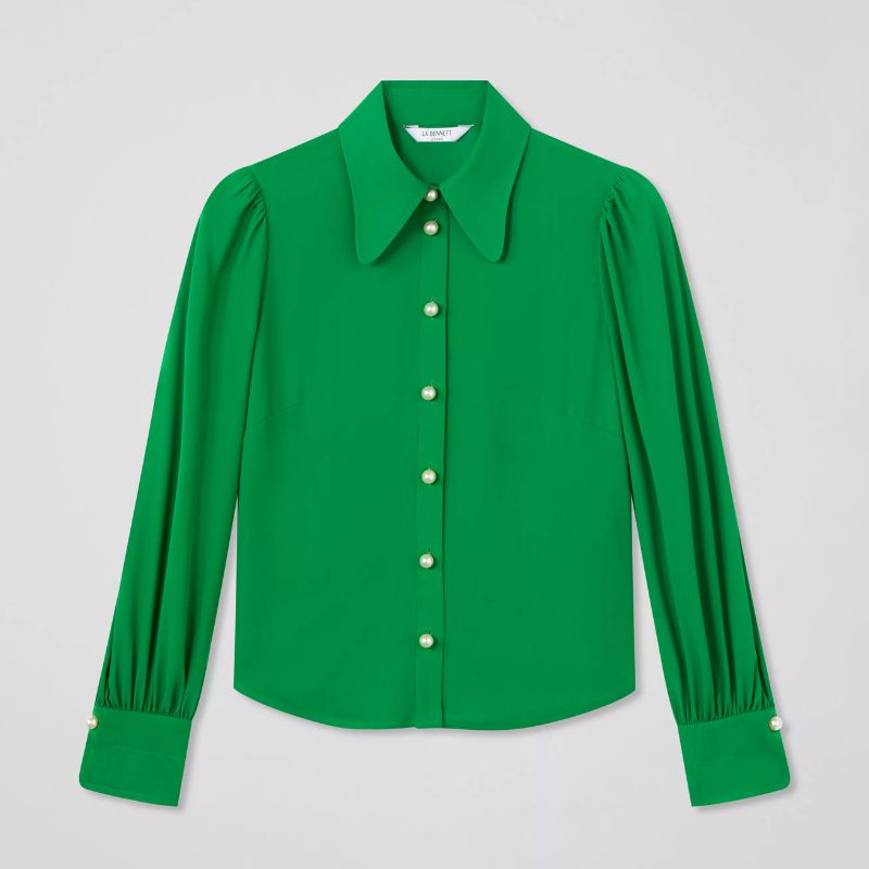 A cutout of a green silk blouse by LK Bennett