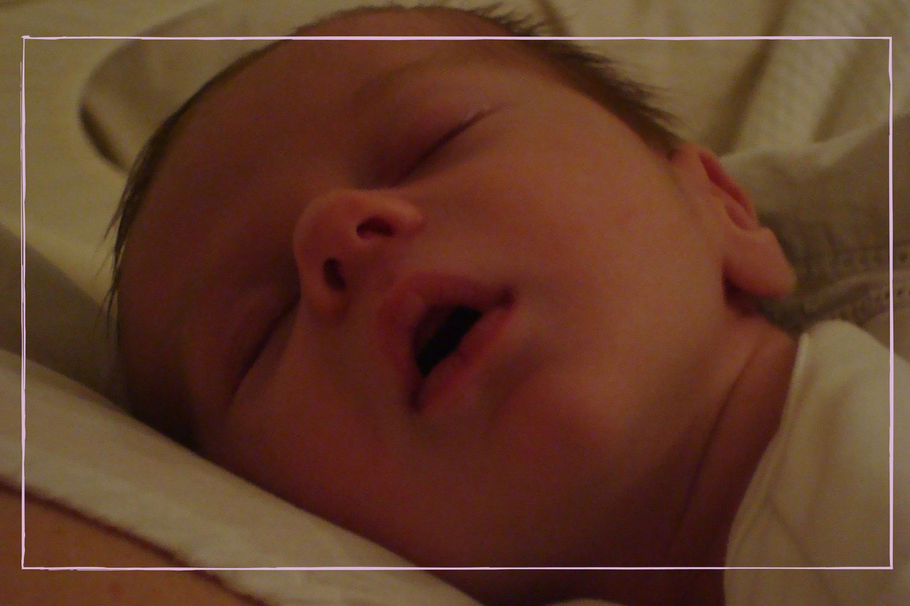 Baby laying on mother&#039;s chest