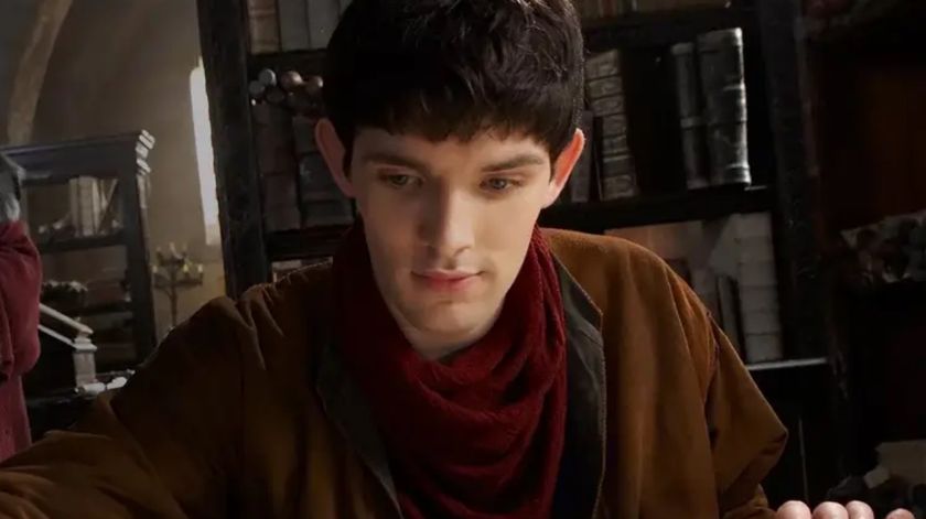 Merlin reading a book