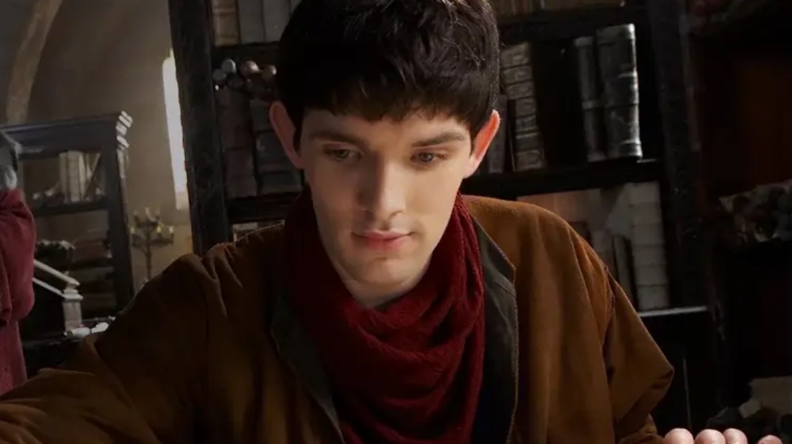 Merlin reading a book