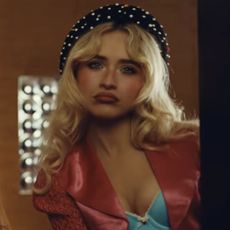Sabrina Carpenter wore a bra top and micro-mini, leopard-print hot pants in the "House Tour" music video