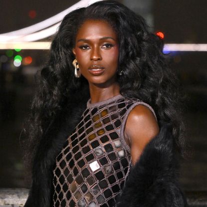 Jodie Turner-Smith attended the Burberry Fall 2026 runway show in a disco mini dress, over-the-knee leather boots, a fur coat, and fringe bag