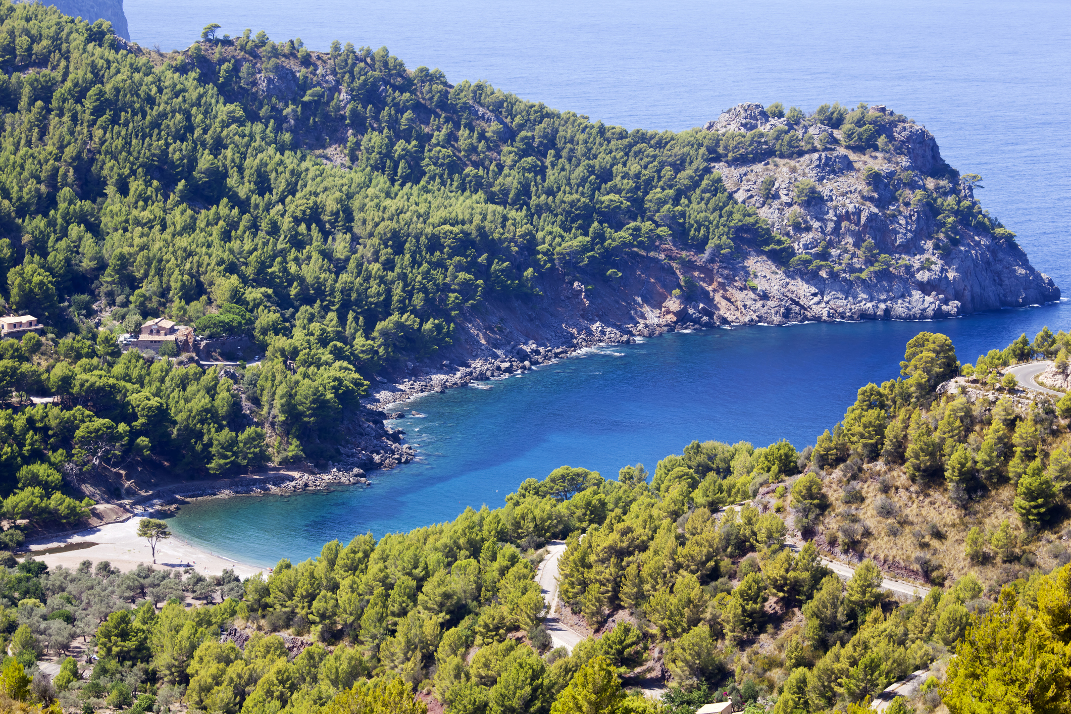 The unspoilt cove and beach at Cala Tuent on the North western coast of Majorca