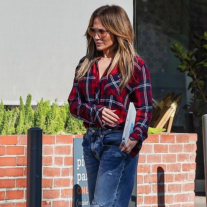 Jennifer Lopez Test Drives the Apple Picking Aesthetic in a Plaid Flannel and Torn-Up Jeans