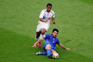 Italy's Gennaro Gattuso slides in to win the ball ahead of France's Florent Malouda in the 2006 World Cup final.