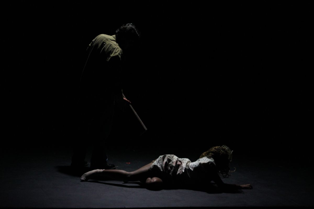 Darkened figure standing over Silent Hill nurse in Silent Hill 2 stage adaptation "Our Special Place"