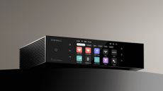 A promotional photo of the Eversolo T8 streaming transport taken from in front and slightly below with the touchscreen displaying app icons