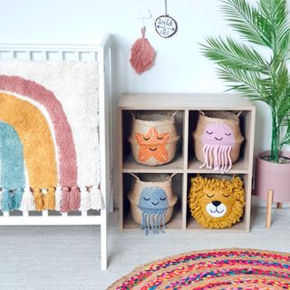 Nursery storage baskets with animal motifs