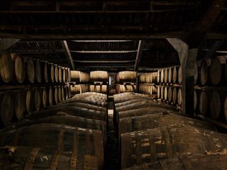 The Dalmore cask warehouse with Dalmore whiskey ageing in wooden barrels