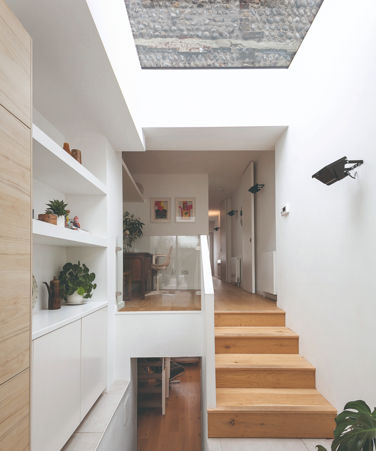 View from the kitchen of the hallway leading up to second storey