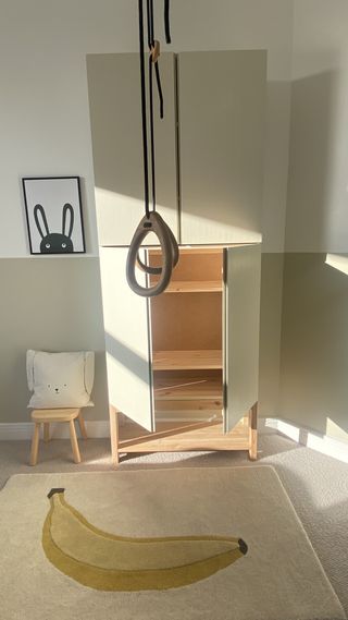 An IKEA IVAR cabinet painted light beige and sun streaming into the room