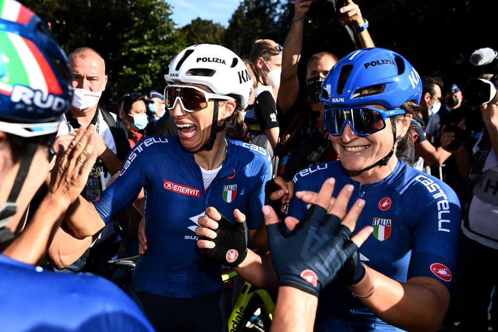 Elisa Balsamo (left, white helmet) celebrates winning elite women&#039;s road race World Championship in Leuven alongside Italian teammate Elisa Longo Borghini