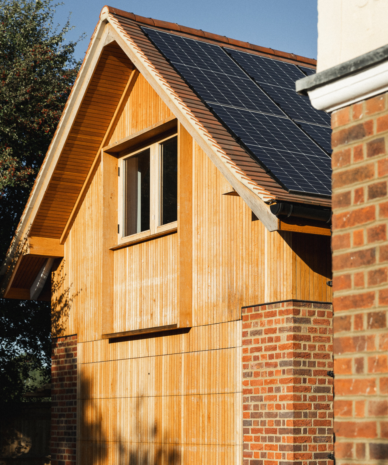 Close up of house with solar panels on pitched roof