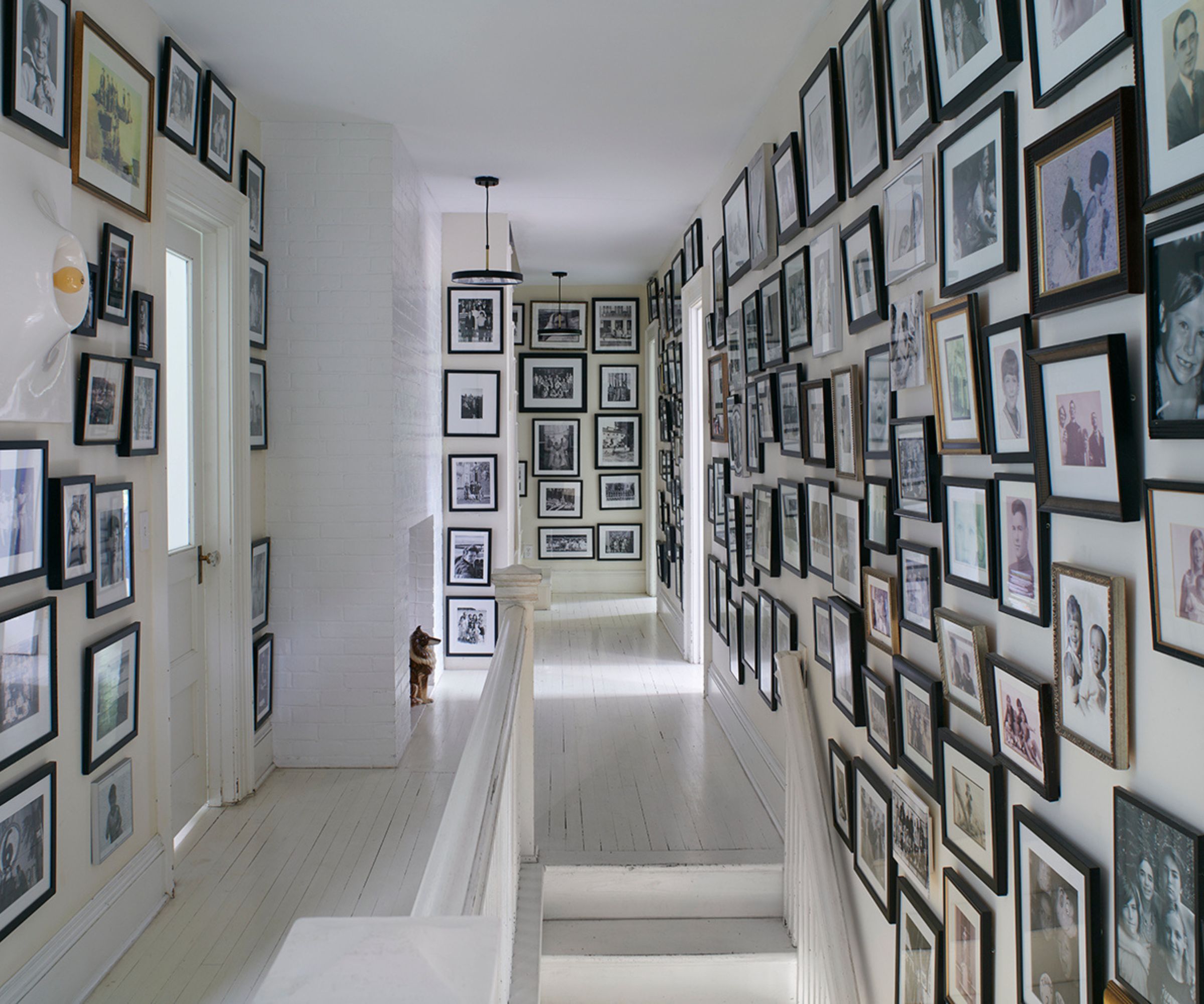 White entryway covered in frames