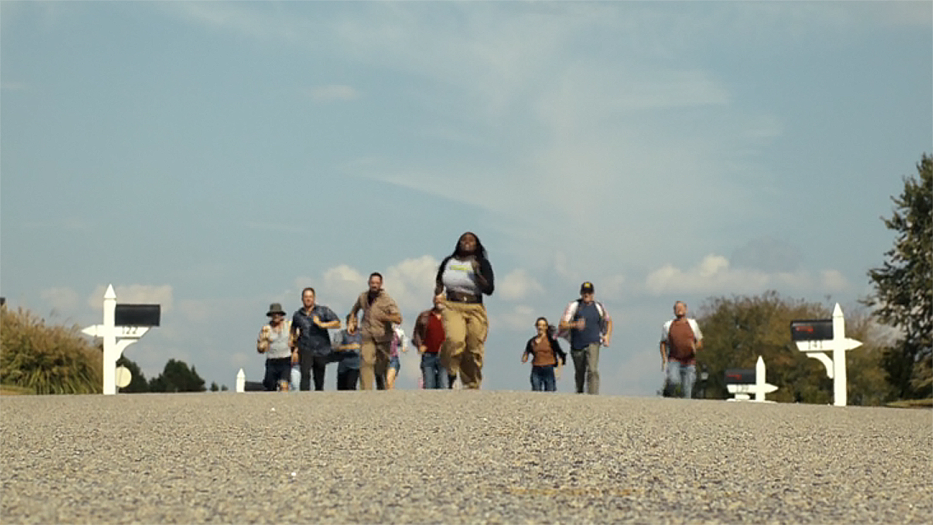 Leota Adebayo running away from a baying mob in Peacemaker season 2 episode 6