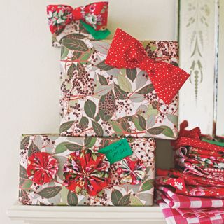 Stack of christmas presents with gift wrap and bows