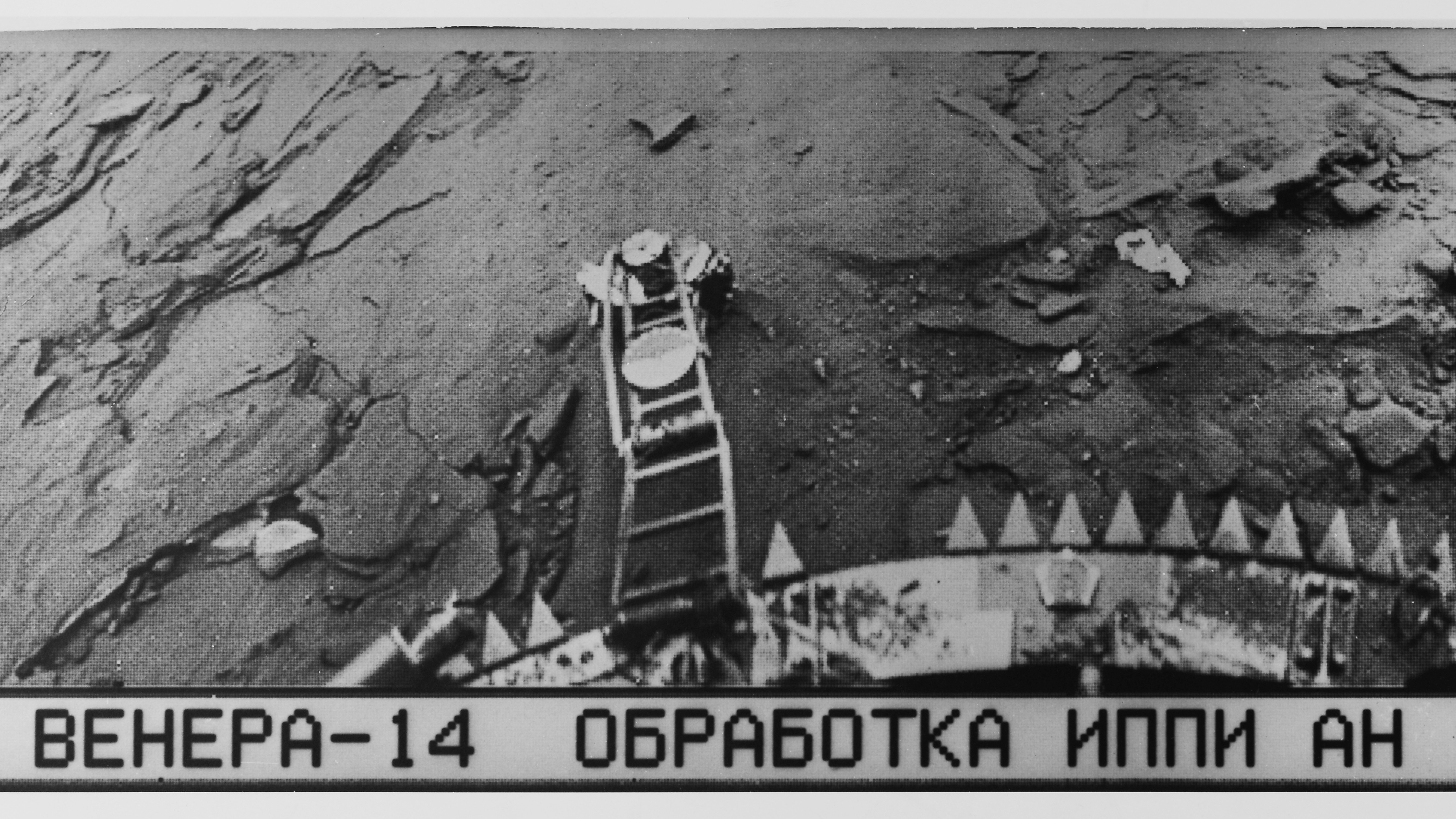This is an image of Venus from Soviet Venera program probe Venera 14 taken in 1982. The Cyrillic text below the pictures reads: &ldquo;Venera 14 brabotka IPPI AN SSSR TsDKS,&rdquo;short for &ldquo;Venera 14, Processing, Institute for Problems in Transmitting Information, Academy of Sciences, Union of Soviet Socialist Republics, Centre for Long-Distance Space Communications.&rdquo;