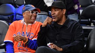 Spike Lee and Denzel Washington watching a basketball game