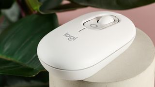 Close-up of rear of Logitech POP on plinth with plant in background