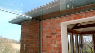 glass link to brick house