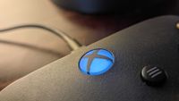 A close up of the Xbox button on an Xbox controller