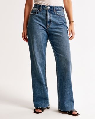 close upshot of Abercrombie & Fitch wearing blue jeans and black heels