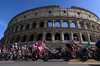 Tadej Pogačar riding passed the colosseum at the Giro d'Italia 2024