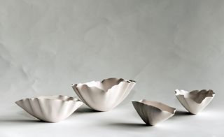Four shell shaped bowls.