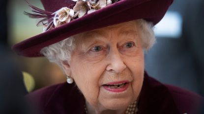 Queen Elizabeth II talks with MI5 officers during a visit to the headquarters of MI5 at Thames House on February 25, 2020 in London