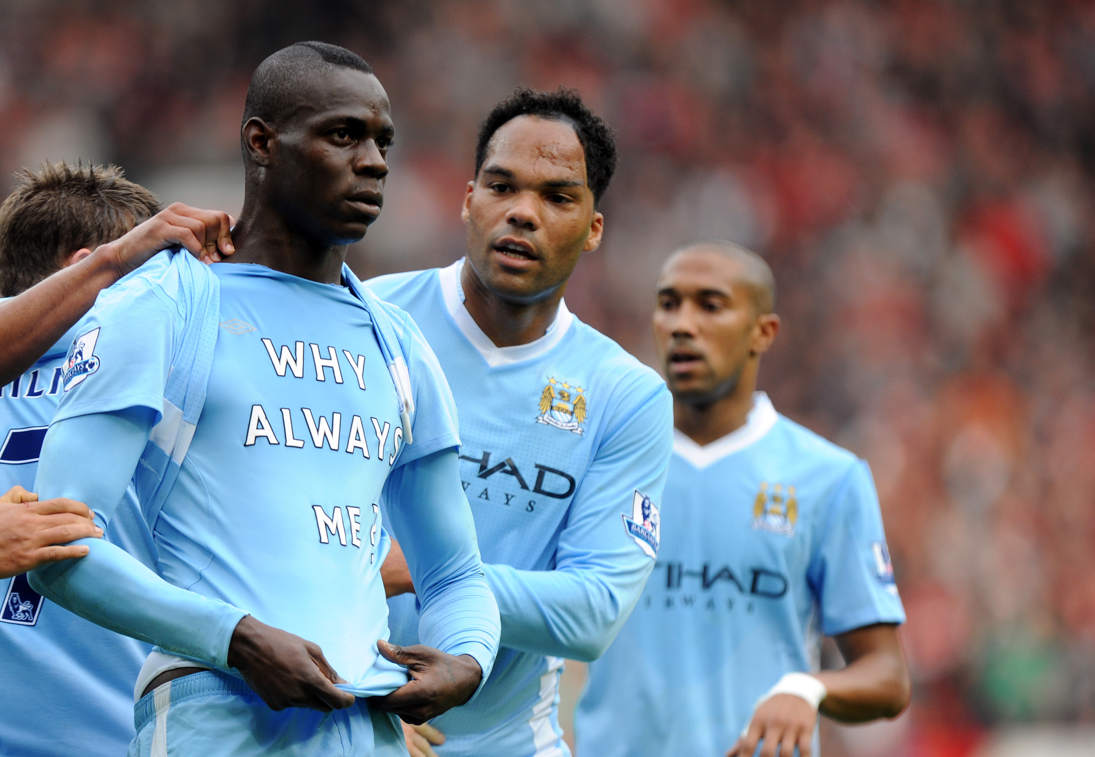 Mario Balotelli's famous 'Why always me?' celebration in the Manchester derby