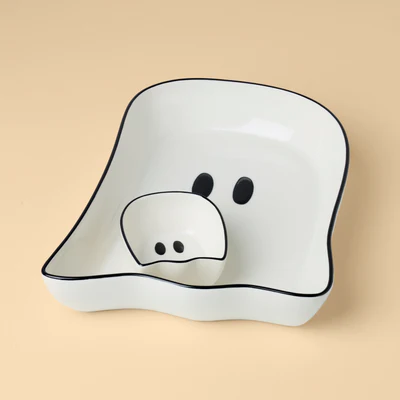 A deep sided ghost-shaped serving plate with a smaller version inside for dip.