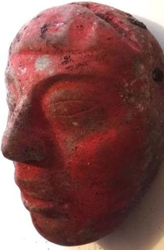 A jade mask painted red with cinnabar was found in the tomb of the Maya ruler.